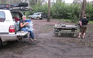 10-Andrea takes a lunch break while Gunther prepares his snack at the table
